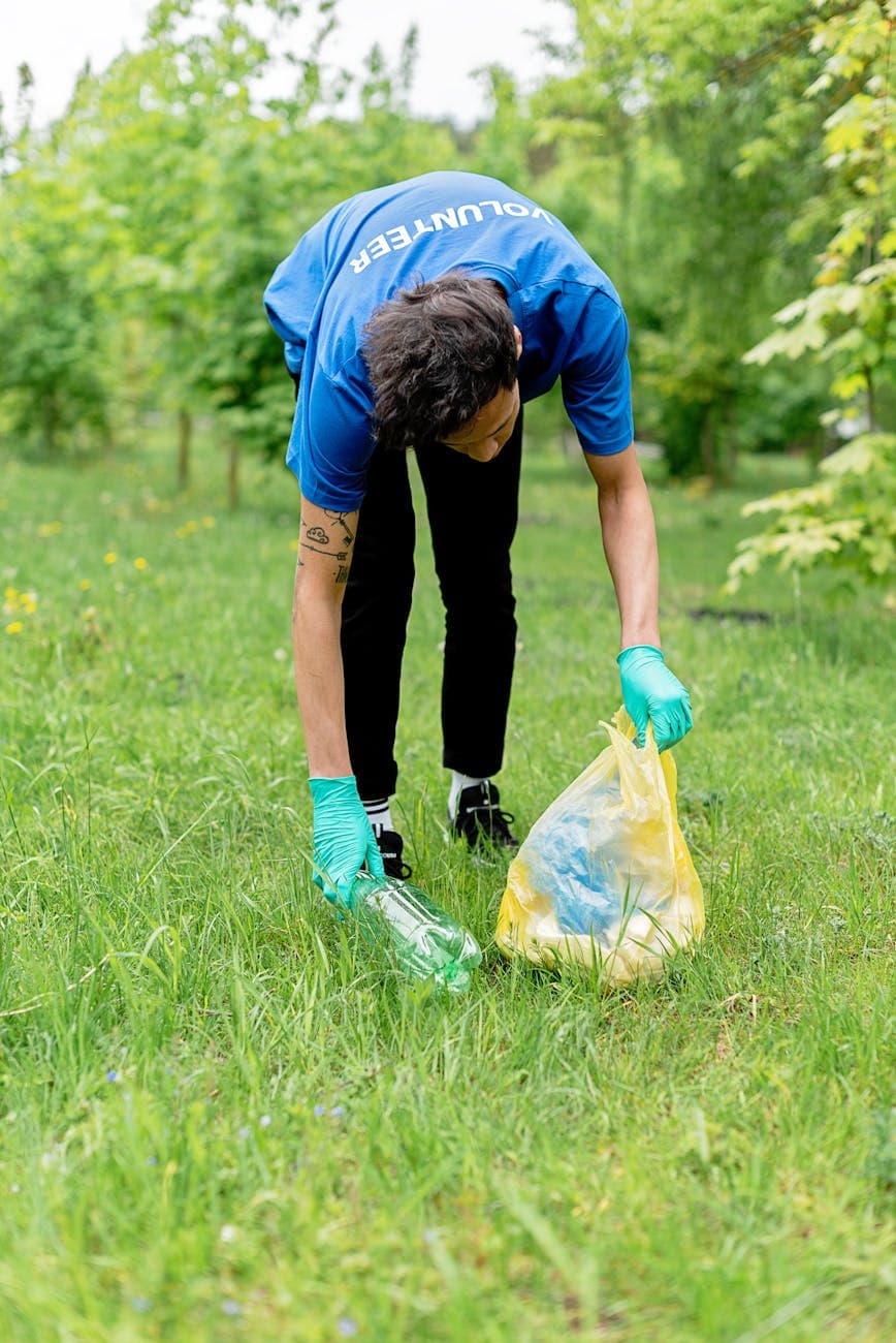 white man collecting plastic